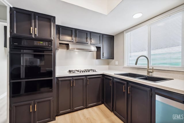 4401 Hughes Ln Unit 148, Bakersfield, CA 93304 - kitchen with black oven, a warming drawer, dishwasher, light countertops, and recessed lighting