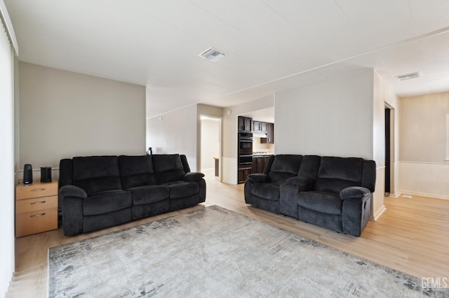 4401 Hughes Ln Unit 148, Bakersfield, CA 93304 - living area featuring light wood-style floors