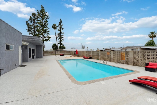 4401 Hughes Ln Unit 148, Bakersfield, CA 93304 - view of pool featuring a patio area and a fenced backyard