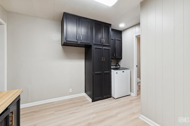 4401 Hughes Ln Unit 148, Bakersfield, CA 93304 - laundry area featuring cabinet space, light wood-style floors, and separate washer and dryer