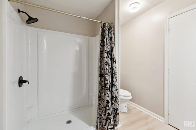 4401 Hughes Ln Unit 148, Bakersfield, CA 93304 - full bath with a shower with shower curtain and wood finished floors