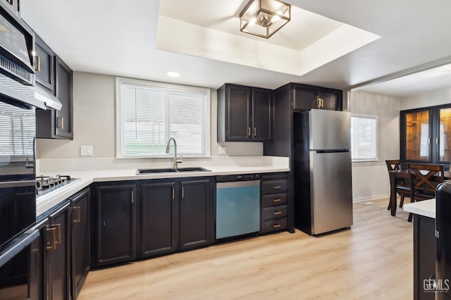 4401 Hughes Ln Unit 148, Bakersfield, CA 93304 - kitchen featuring appliances with stainless steel finishes, light countertops, light wood-style flooring, plenty of natural light, and recessed lighting