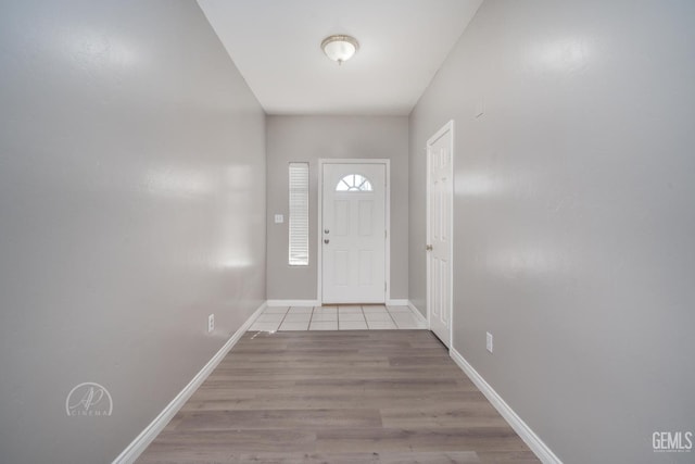 doorway with light hardwood / wood-style flooring