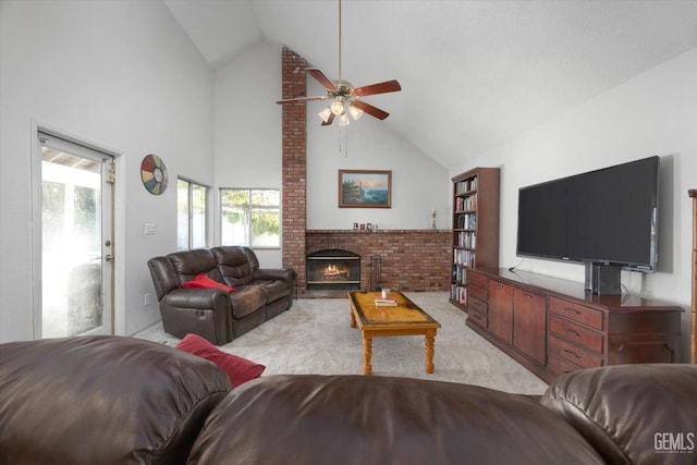 carpeted living room featuring a fireplace, high vaulted ceiling, and ceiling fan