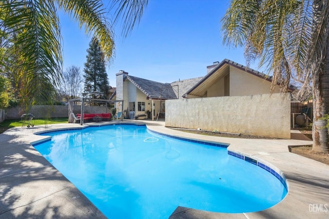 view of swimming pool with a patio area