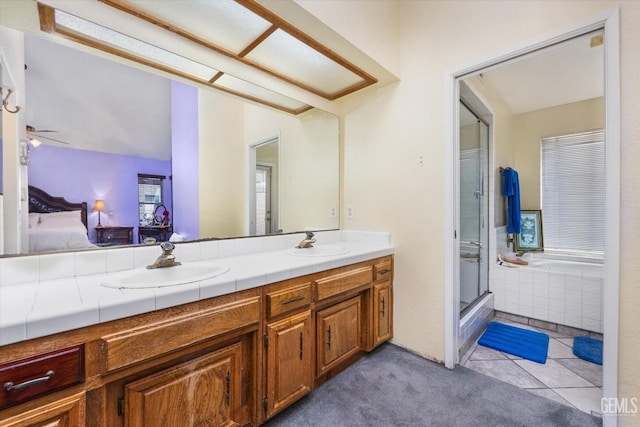 bathroom featuring vanity, tile patterned floors, and independent shower and bath