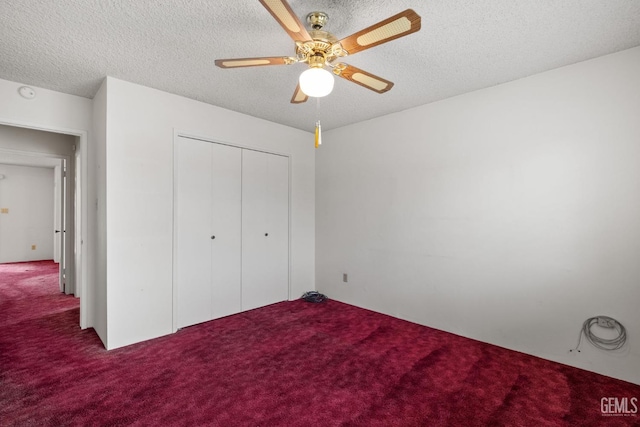 unfurnished bedroom with carpet flooring and a textured ceiling