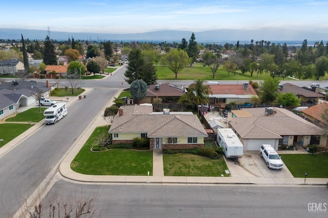 aerial view with a mountain view and a residential view