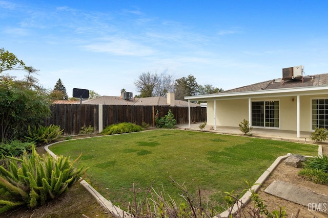 view of yard featuring cooling unit, a patio, and a fenced backyard