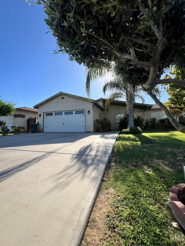 107 Coverdale Ct, Bakersfield, CA 93307 - single story home featuring stucco siding, a garage, concrete driveway, and a front lawn