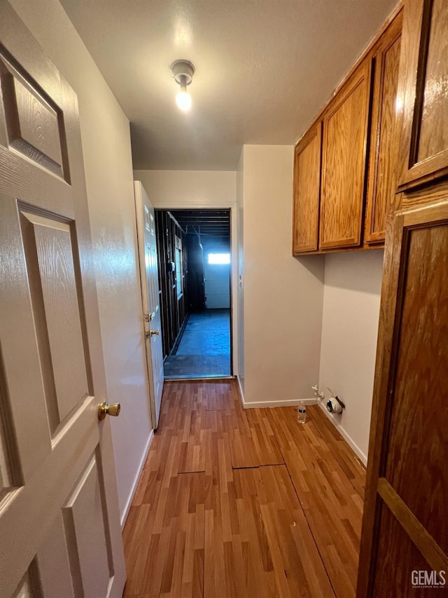 107 Coverdale Ct, Bakersfield, CA 93307 - washroom with light wood-style floors and baseboards