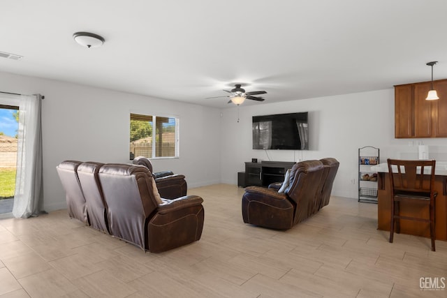 5502 White Wheat Ave, Bakersfield, CA 93313 - living room with ceiling fan and baseboards