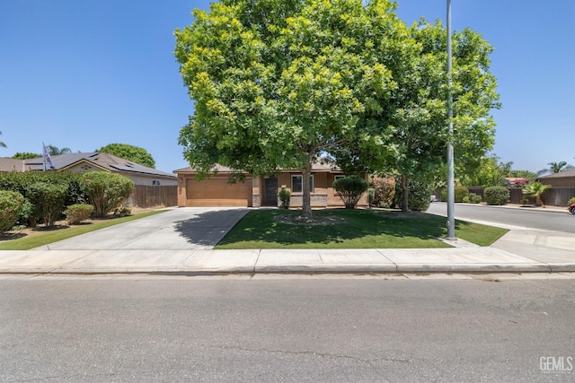 5502 White Wheat Ave, Bakersfield, CA 93313 - obstructed view of property with driveway and an attached garage