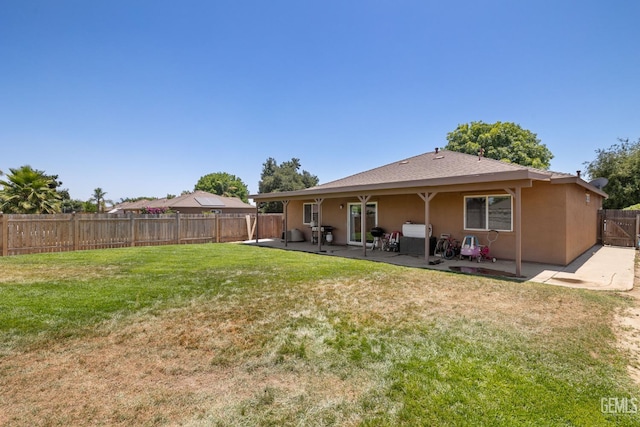 5502 White Wheat Ave, Bakersfield, CA 93313 - rear view of house with a patio area and stucco siding