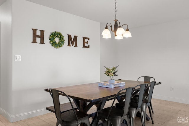 5502 White Wheat Ave, Bakersfield, CA 93313 - dining space featuring a chandelier, light wood-type flooring, and baseboards
