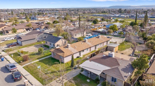 birds eye view of property with a residential view