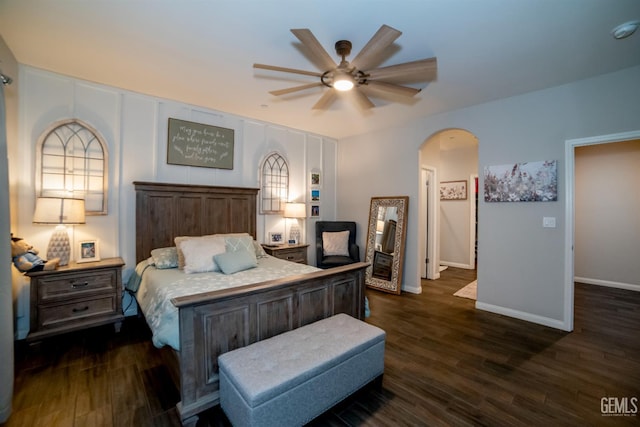 8414 Kowa St, Bakersfield, CA 93314 - bedroom with arched walkways, dark wood-type flooring, and a ceiling fan