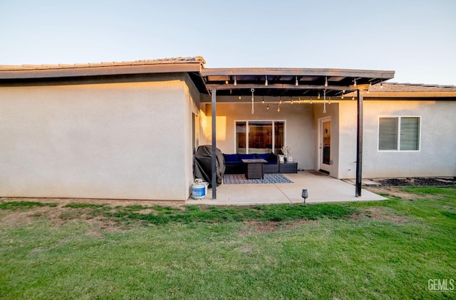 8414 Kowa St, Bakersfield, CA 93314 - back of property with outdoor lounge area, stucco siding, a patio area, and a yard