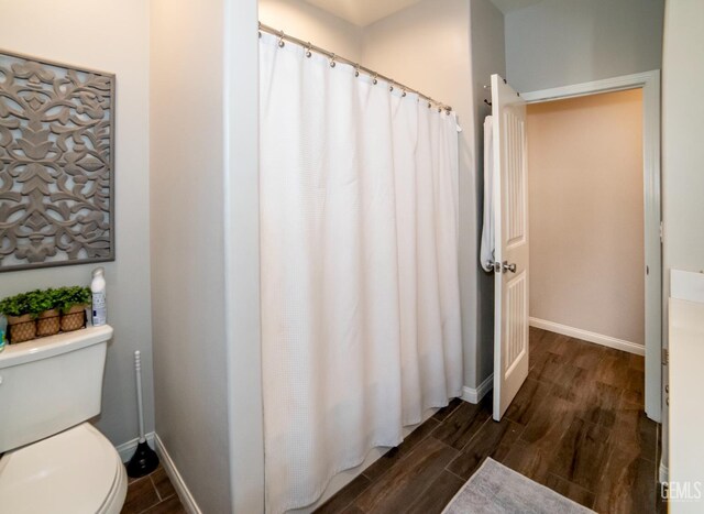 8414 Kowa St, Bakersfield, CA 93314 - full bathroom featuring wood finished floors and curtained shower
