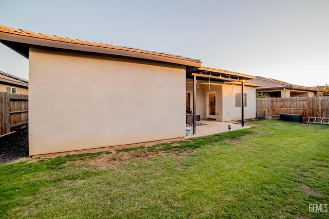 8414 Kowa St, Bakersfield, CA 93314 - rear view of property with stucco siding, a patio area, and a fenced backyard