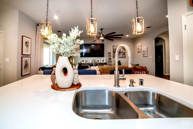 8414 Kowa St, Bakersfield, CA 93314 - kitchen featuring open floor plan, arched walkways, a ceiling fan, hanging light fixtures, and recessed lighting