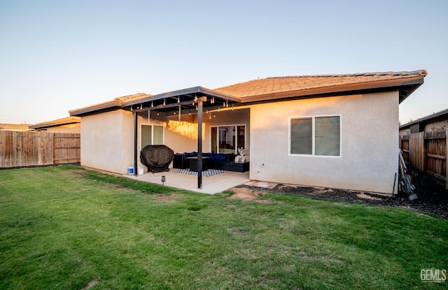 8414 Kowa St, Bakersfield, CA 93314 - back of property with outdoor lounge area, a fenced backyard, a patio, stucco siding, and a tiled roof