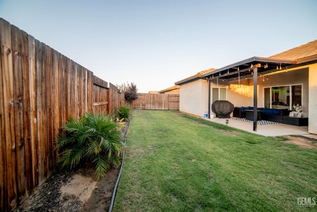 8414 Kowa St, Bakersfield, CA 93314 - fenced backyard with outdoor lounge area and a patio area