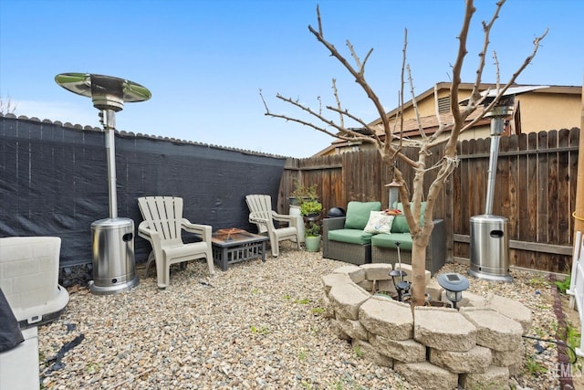 view of yard with a patio and a fire pit