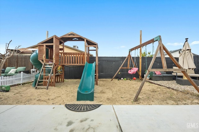 view of playground with a patio