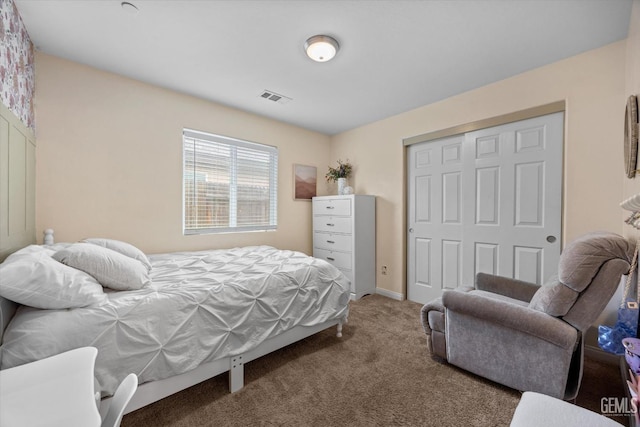 carpeted bedroom with a closet