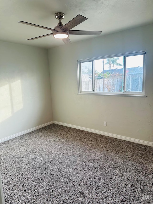 spare room with ceiling fan