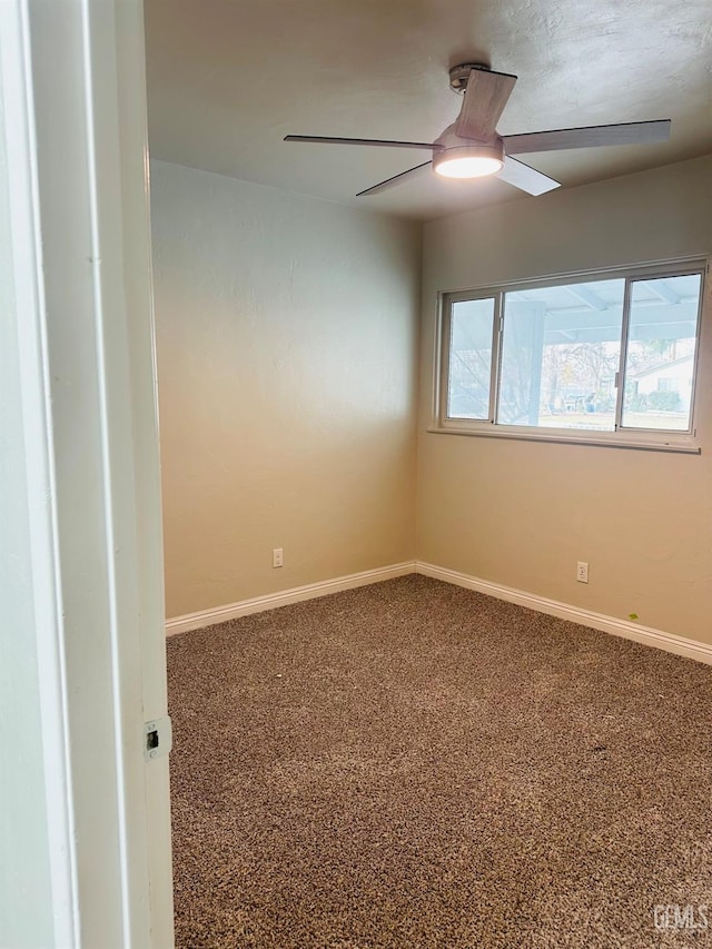 carpeted empty room with ceiling fan