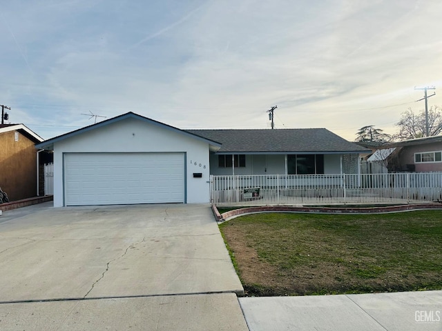 ranch-style house featuring a front yard, a porch, and a garage