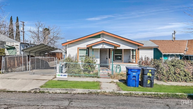 view of front of home featuring a carport and a porch