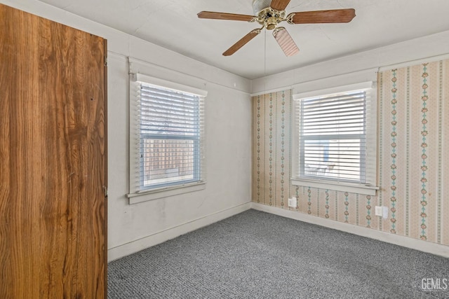 unfurnished room featuring carpet floors and ceiling fan