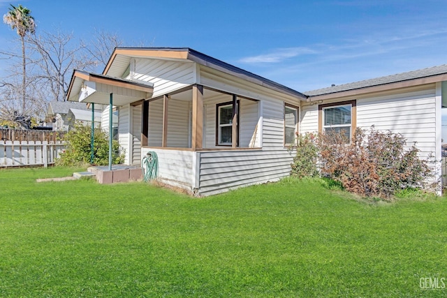 view of property exterior featuring a lawn