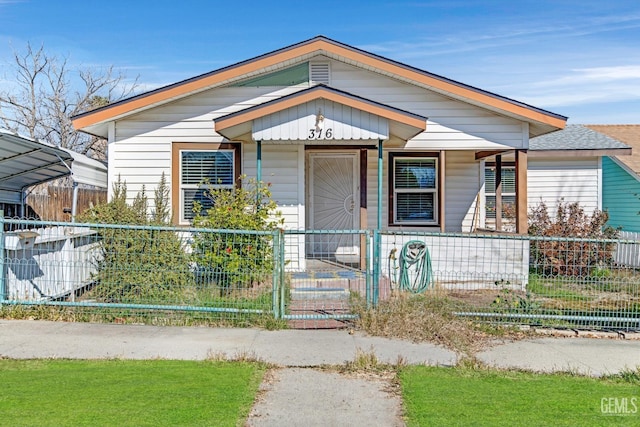 bungalow-style home featuring a carport