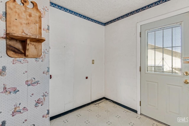 empty room featuring a textured ceiling