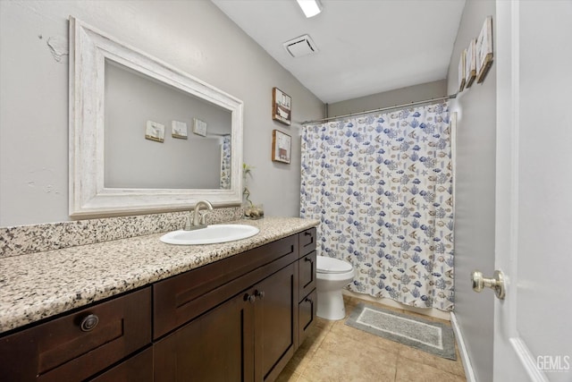 bathroom with visible vents, toilet, a shower with shower curtain, tile patterned flooring, and vanity