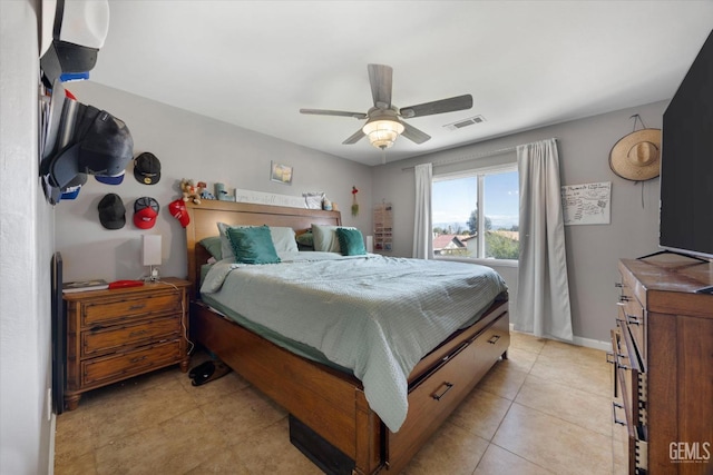 bedroom with light tile patterned floors, visible vents, baseboards, and ceiling fan