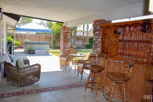 1301 Charterten Ave, Bakersfield, CA 93307 - fenced backyard with a hot tub and a patio area
