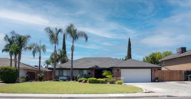 1301 Charterten Ave, Bakersfield, CA 93307 - ranch-style home featuring a garage, driveway, and brick siding
