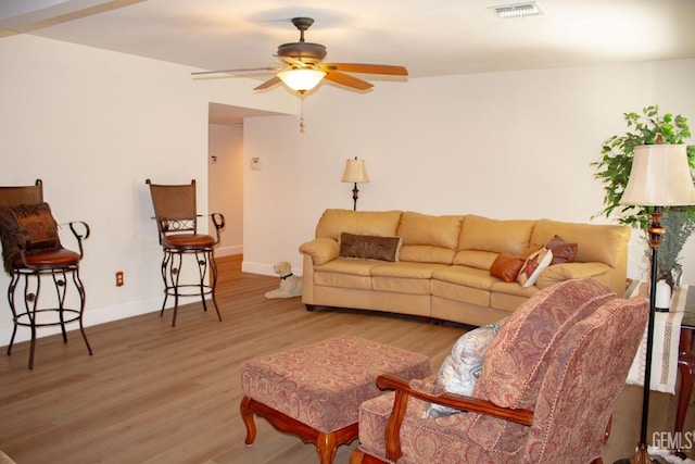 1301 Charterten Ave, Bakersfield, CA 93307 - living room featuring wood finished floors, baseboards, and a ceiling fan