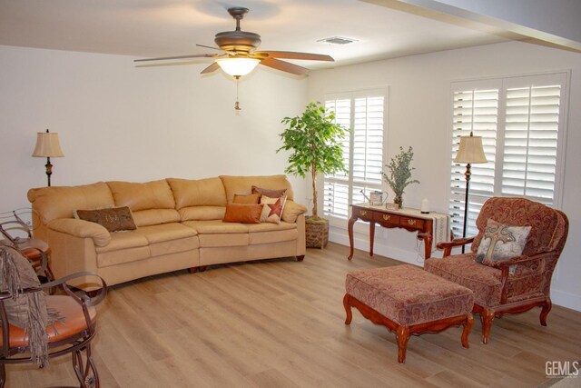 1301 Charterten Ave, Bakersfield, CA 93307 - living area with light wood-style flooring and ceiling fan