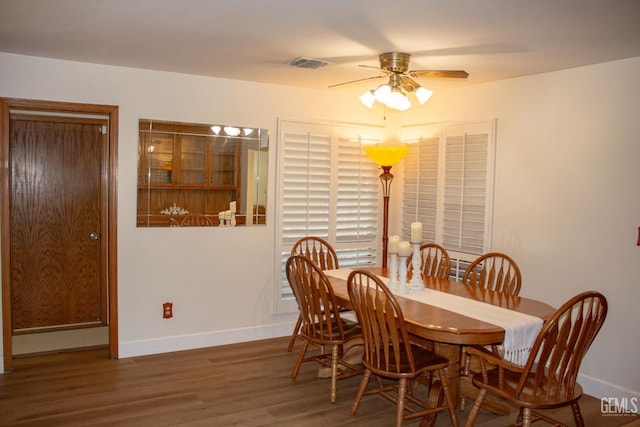 1301 Charterten Ave, Bakersfield, CA 93307 - dining area with ceiling fan, baseboards, and wood finished floors
