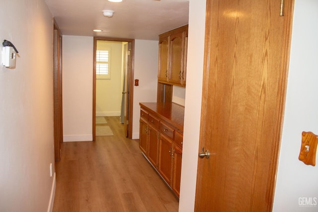 1301 Charterten Ave, Bakersfield, CA 93307 - corridor featuring light wood-style floors and baseboards