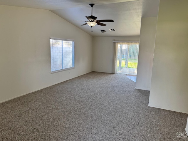 spare room with ceiling fan, carpet floors, and lofted ceiling