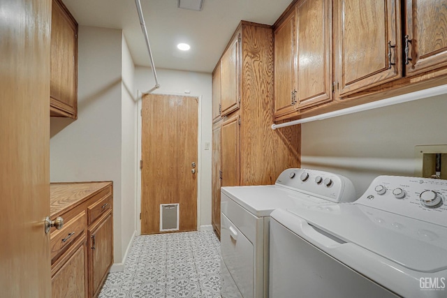 9604 Lea Oak Rd, Bakersfield, CA 93311 - laundry area with washing machine and dryer, cabinet space, and light flooring