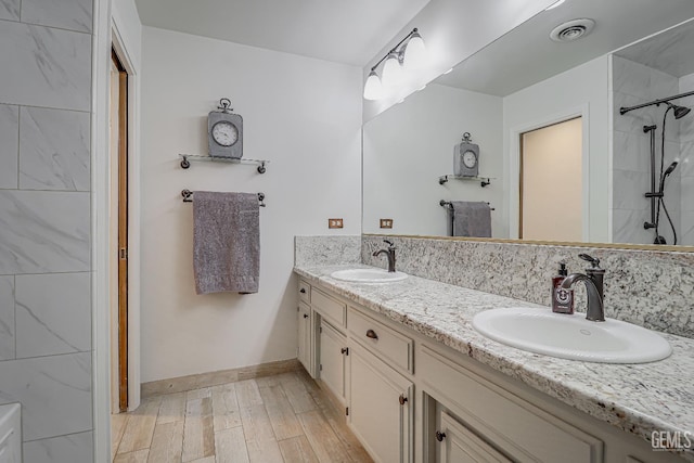 9604 Lea Oak Rd, Bakersfield, CA 93311 - full bath with double vanity, wood finished floors, and a shower