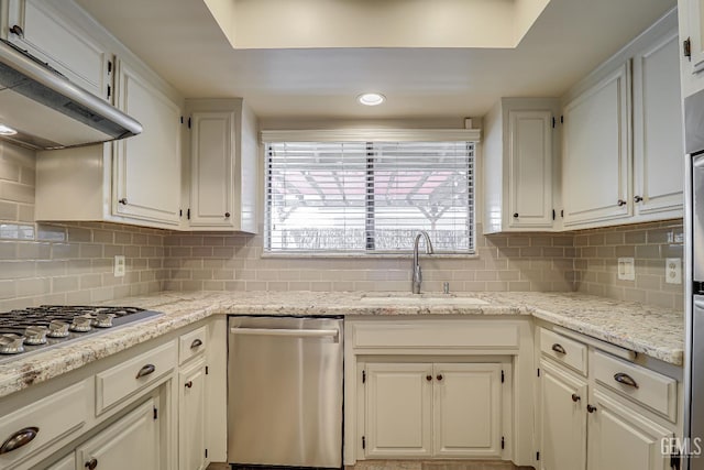 9604 Lea Oak Rd, Bakersfield, CA 93311 - kitchen with stainless steel appliances, exhaust hood, backsplash, white cabinetry, and recessed lighting